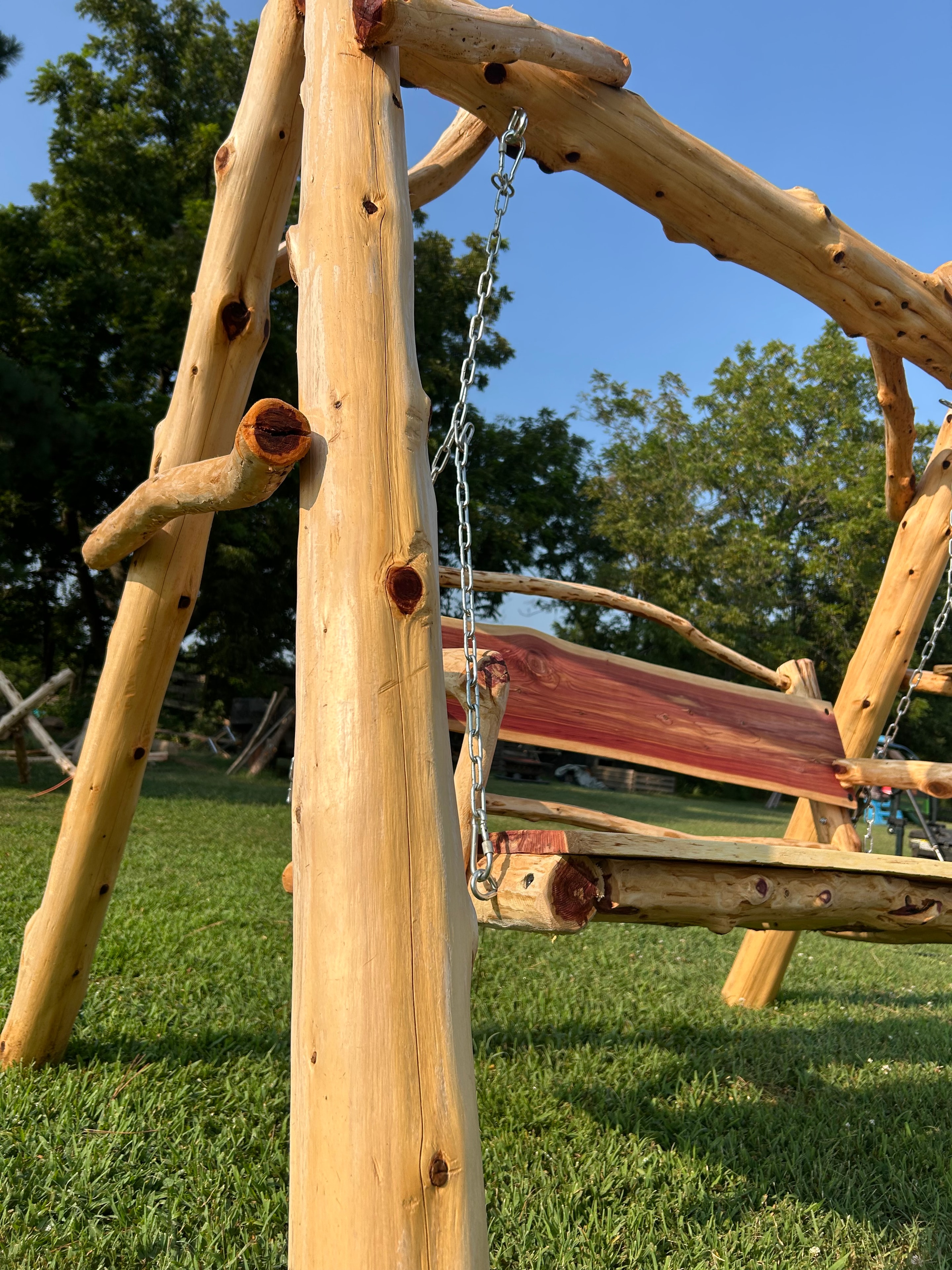 Handcrafted cedar bench swing live-edge slab seat